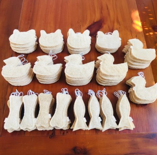 Wholesale natural loofah animal shapes in multiple sizes for kids' bath and pet play.