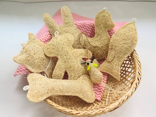 Wholesale loofah pet toys stacked in a clean manufacturing warehouse facility.