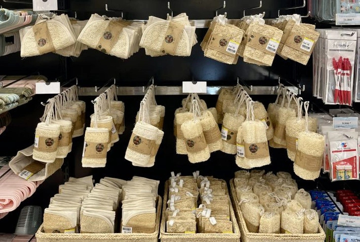 Zero waste kitchen sponge wholesale retail display of premium natural loofah cleaning pads.